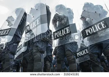 stock-photo-riot-police-used-shields-and-batons-tactical-training-319245191.webp